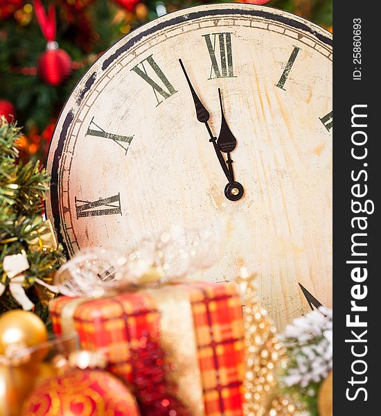 Old wooden clock and Christmas decorations. New year concept. Old wooden clock and Christmas decorations. New year concept