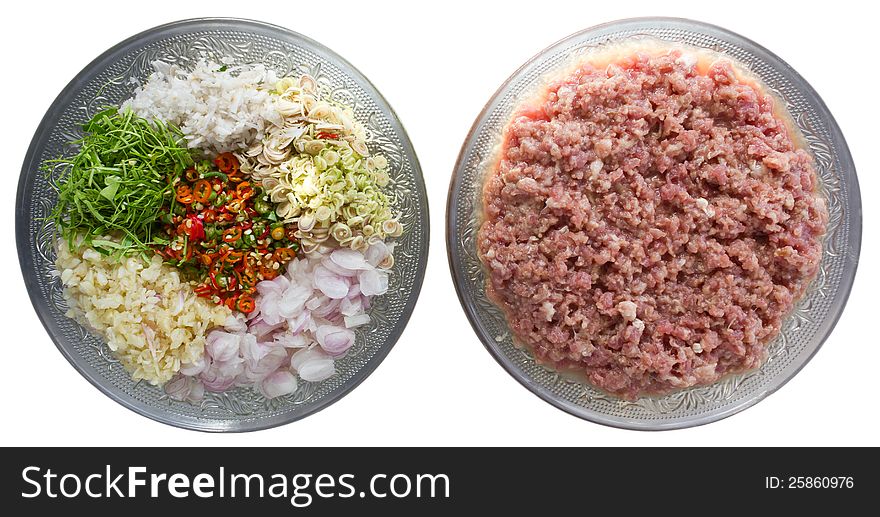 Ground pork and spices, prepared food in a glass dish with gray flower beautifully. Ground pork and spices, prepared food in a glass dish with gray flower beautifully.