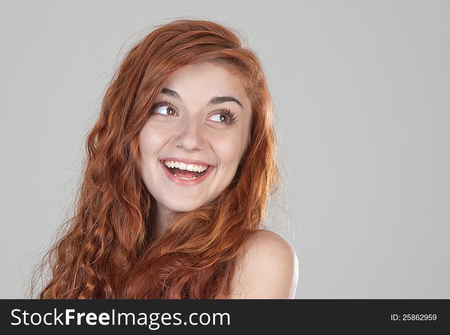 Portrait Of A Smiling Red Haired Girl