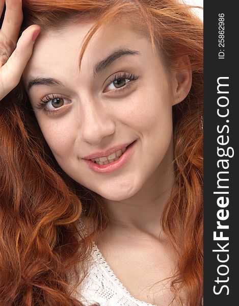 Portrait Of A Smiling Red Haired Girl