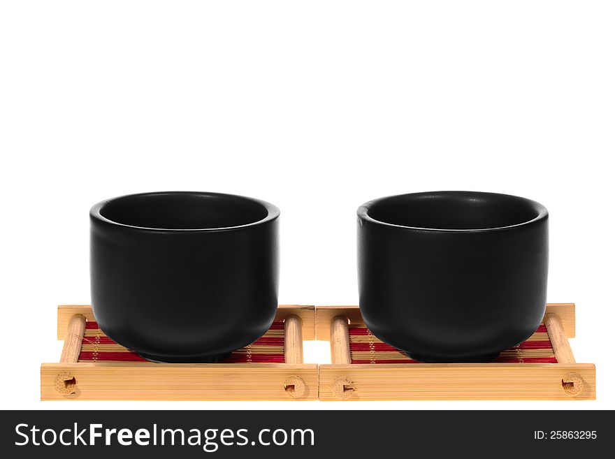 Black cups on a stand isolated on white