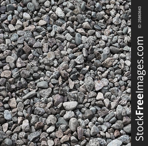 White and black round pebble stones and gravel background. White and black round pebble stones and gravel background