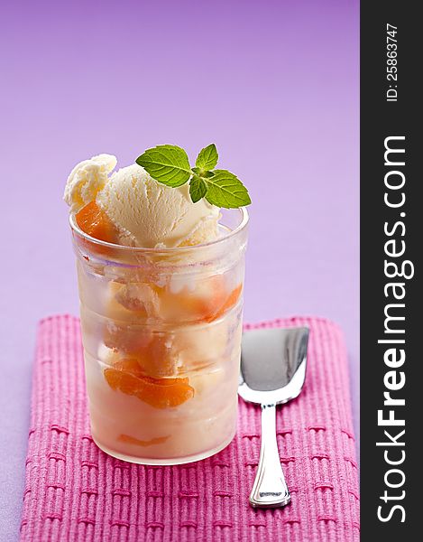 Fresh apricot ice cream in glass close up