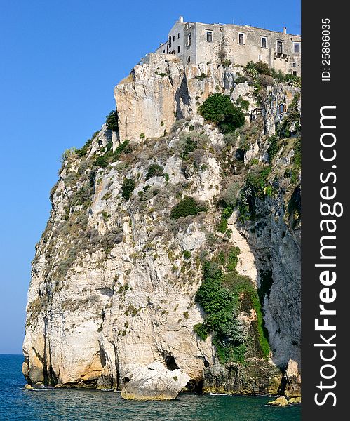 A landscape of the coast of the Gargano, a group of houses overlooking the sea - Peschici (FG). A landscape of the coast of the Gargano, a group of houses overlooking the sea - Peschici (FG)