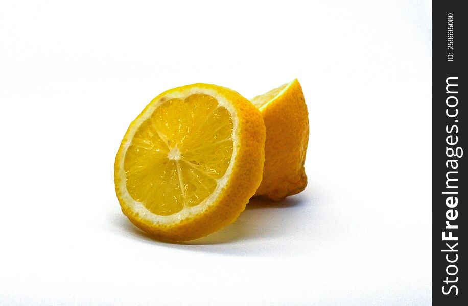 Close-up photo of a lemon and lemon slices.