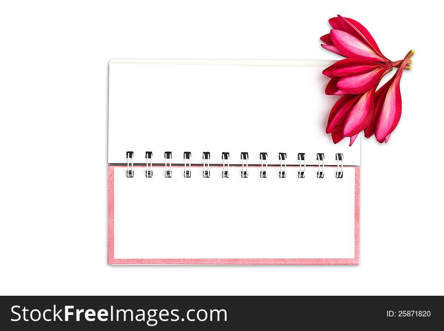 Note book paper with pink frangipani flower, Isolated on white with clipping path