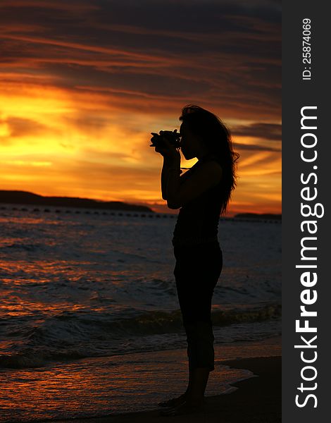 Woman photograph in sunset. Woman photograph in sunset