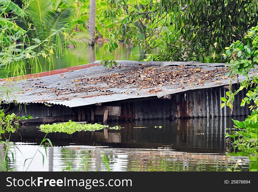 Old house drown in the water after heavy rain ,big flood at angthong,thailand