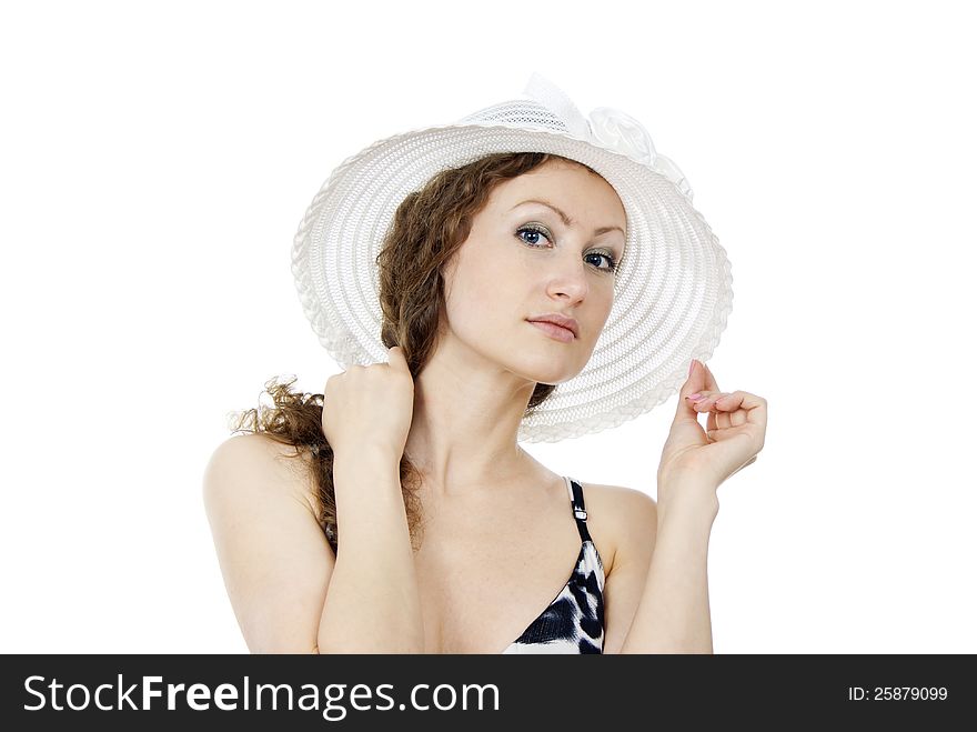 Portrait of a beautiful girl in the hat isolated