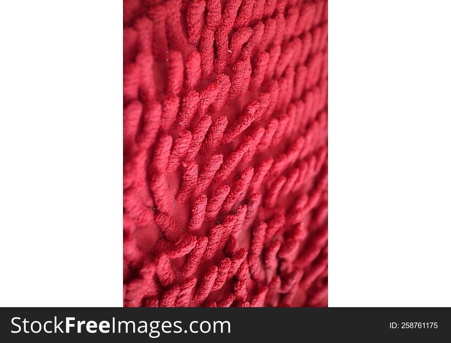 a photo of a the unique texture of the red mat