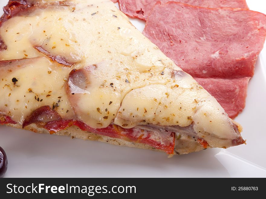 Pizza slice on a plate Closeup