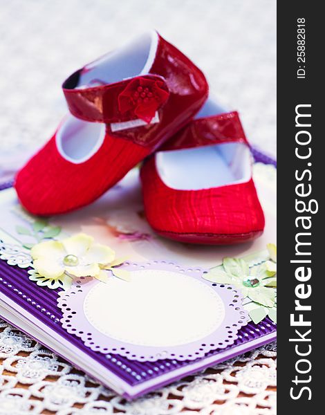 A notebook and pair of shoes or a little girl. A notebook and pair of shoes or a little girl