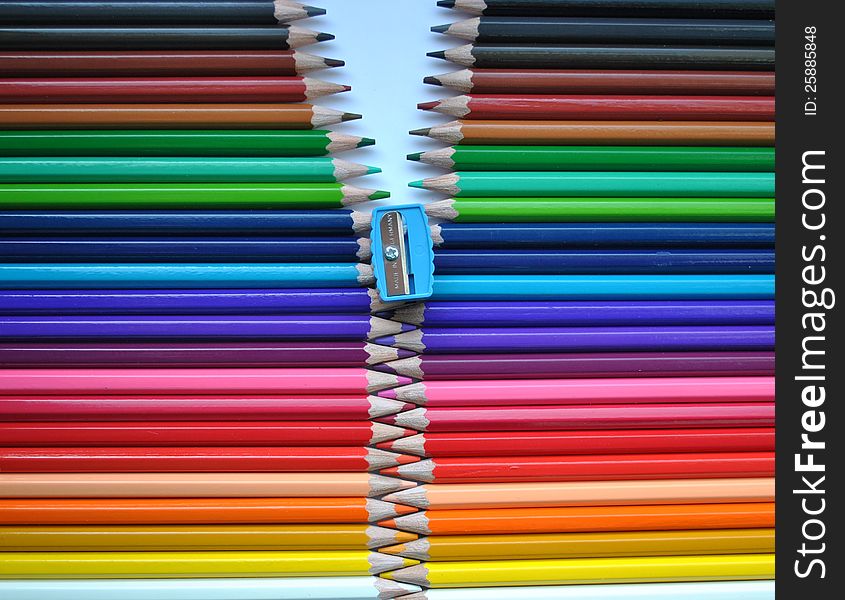 Concept of a zipper made from alligned colored pencils. Concept of a zipper made from alligned colored pencils