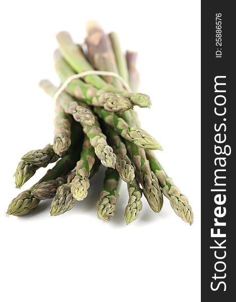 Bunch of fresh organic green asparagus on white background
