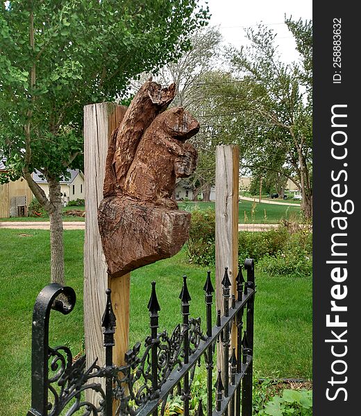 Wooden Squirrel Sculpture At A Park