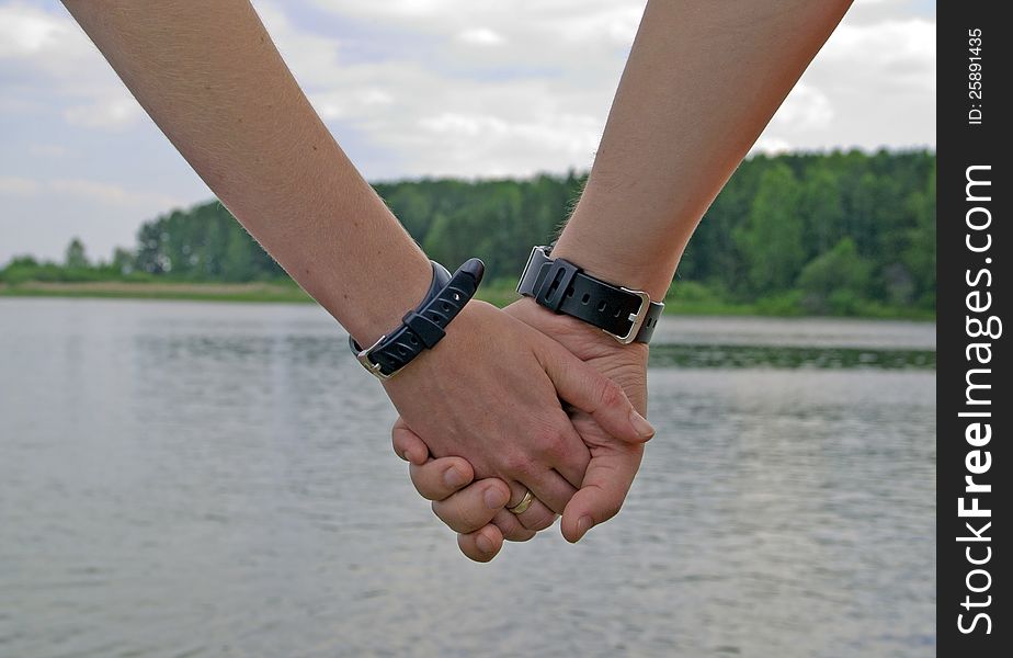 Two hands with watch together