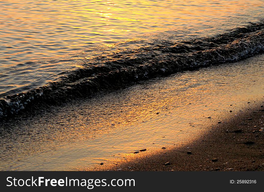 Sandy seashore at sunset