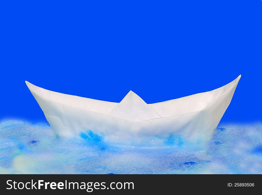 Origami froze boat on blue background. Origami froze boat on blue background