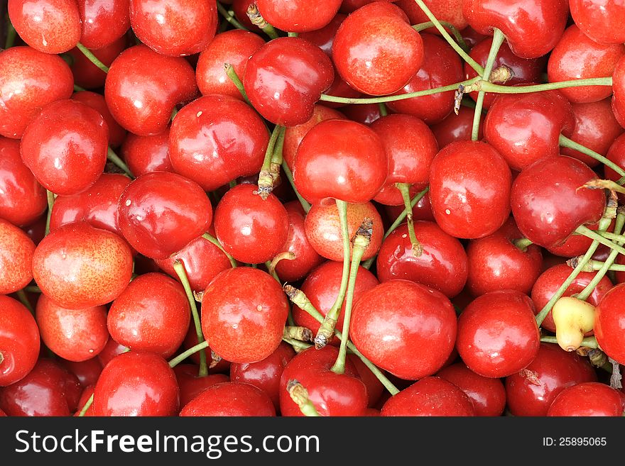 The background of ripe red red cherries