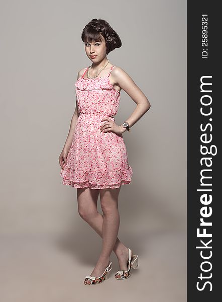 Beautiful girl in a pink dress