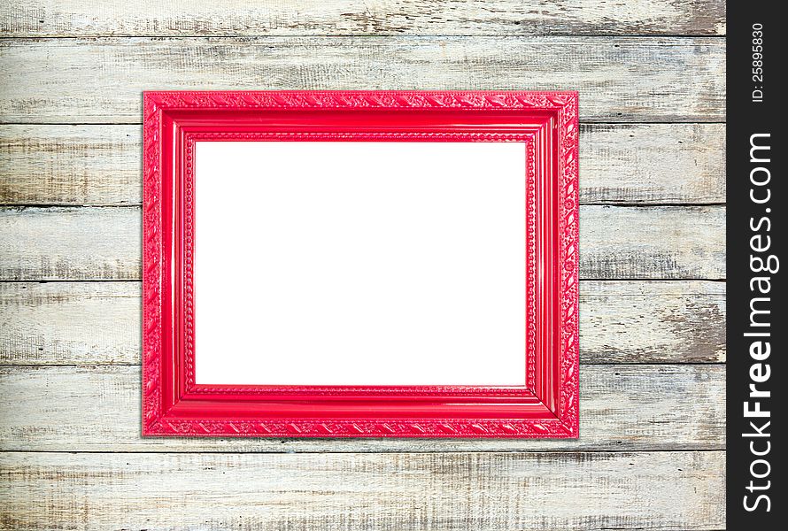 Red Vintage picture frame, wood plated, old wood background, clipping path included. Red Vintage picture frame, wood plated, old wood background, clipping path included