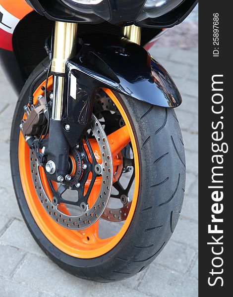 On a photo orange wheel sport bike