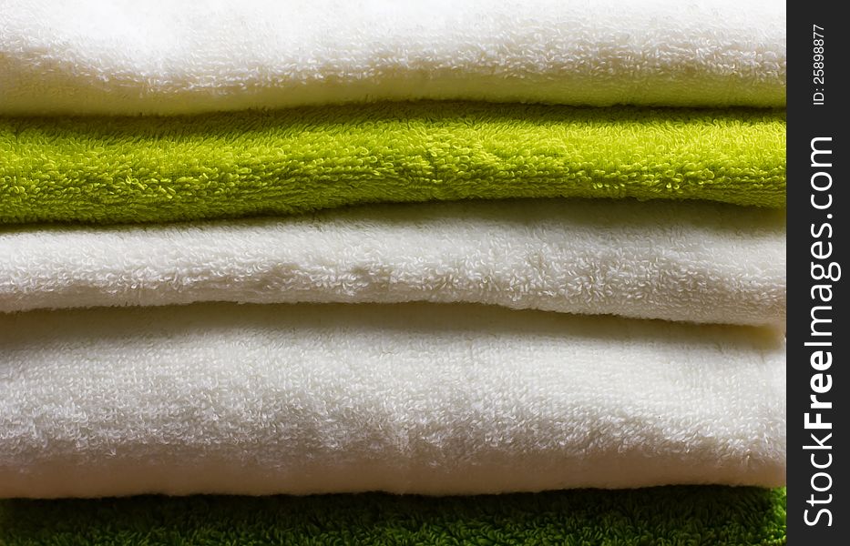 Pile Of Clean White And Green Towels