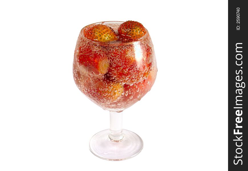 Strawberry in footed tumbler. Isolated, close-up.