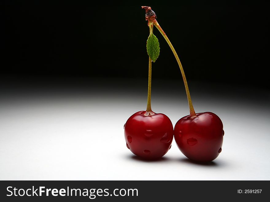 Two Cherries with water drops. Two Cherries with water drops