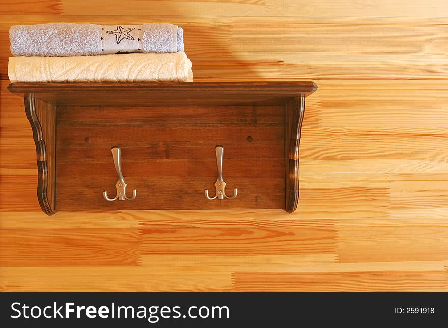 Wooden shelf with a towels