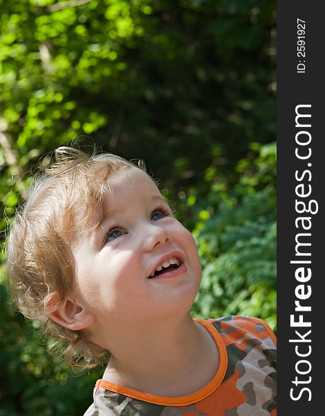 Admired and surprised boy on walk in a scaffold in a sunny day