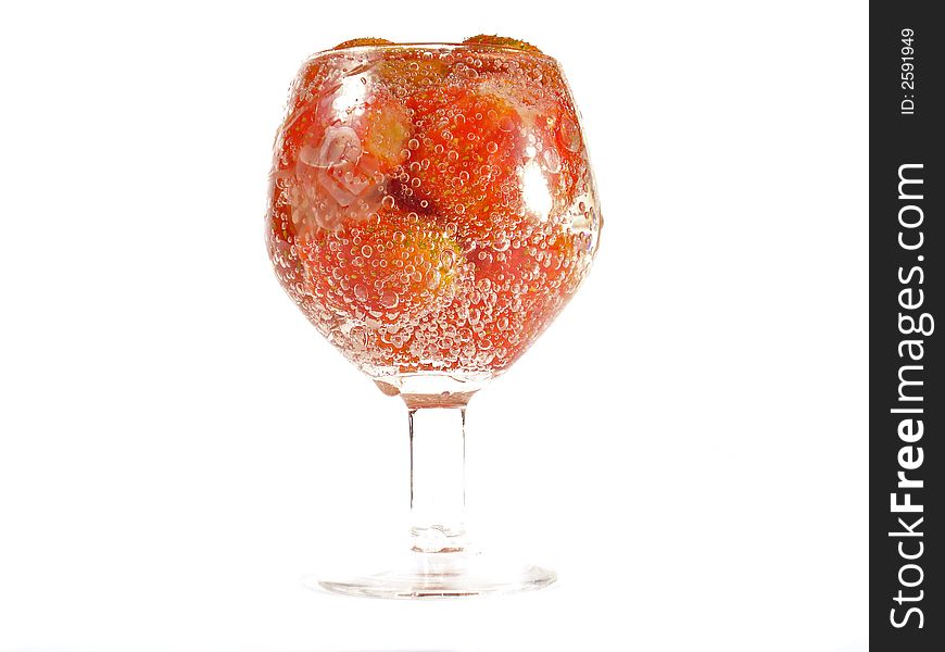 Strawberry in footed tumbler. Isolated, close-up. Strawberry in footed tumbler. Isolated, close-up.