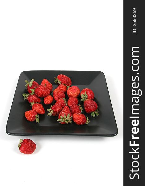 Strawberries On Black Plate Ov
