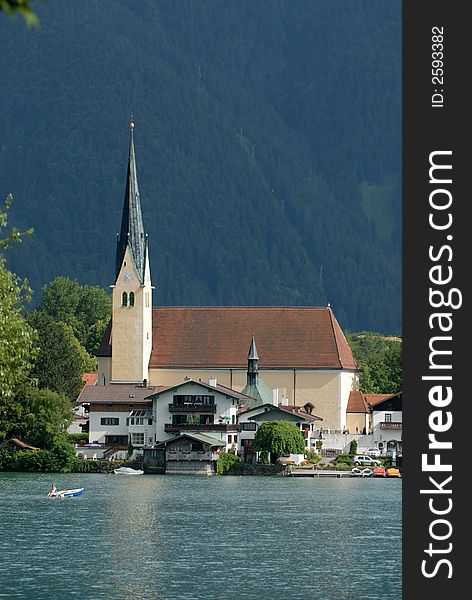 Alps lake with the church on the background. Alps lake with the church on the background