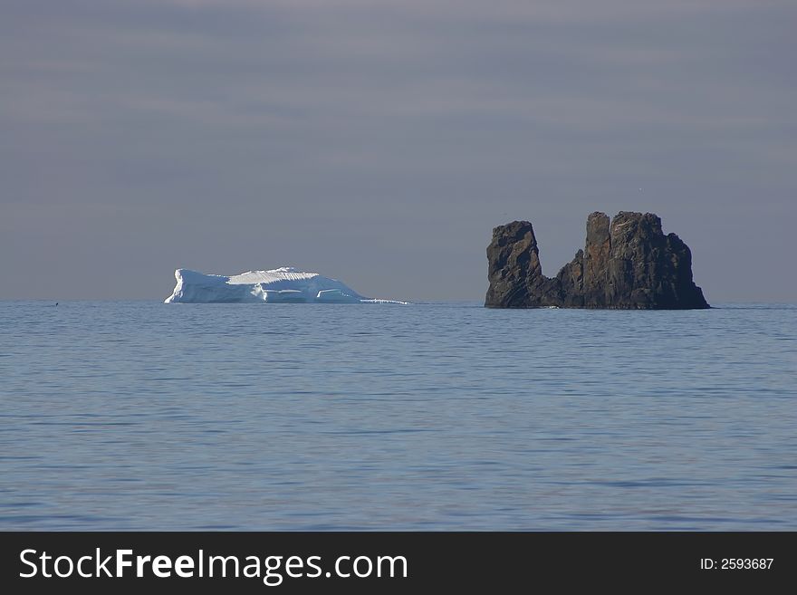 ICEBERG VS ROCK IN THE OCEAN