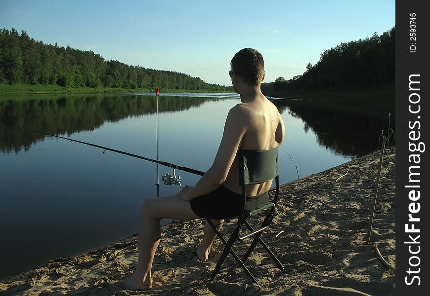 Fisherman at evening. Fine background!