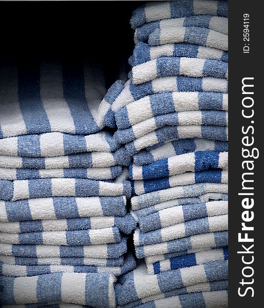 Stacks of striped blue and white towels. Stacks of striped blue and white towels.