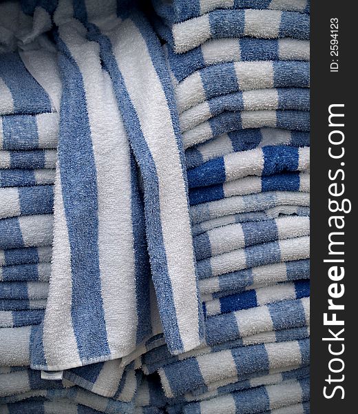 Stacks of striped blue and white towels. Stacks of striped blue and white towels.