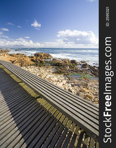 Wood path in mediterranean beachfront during summer