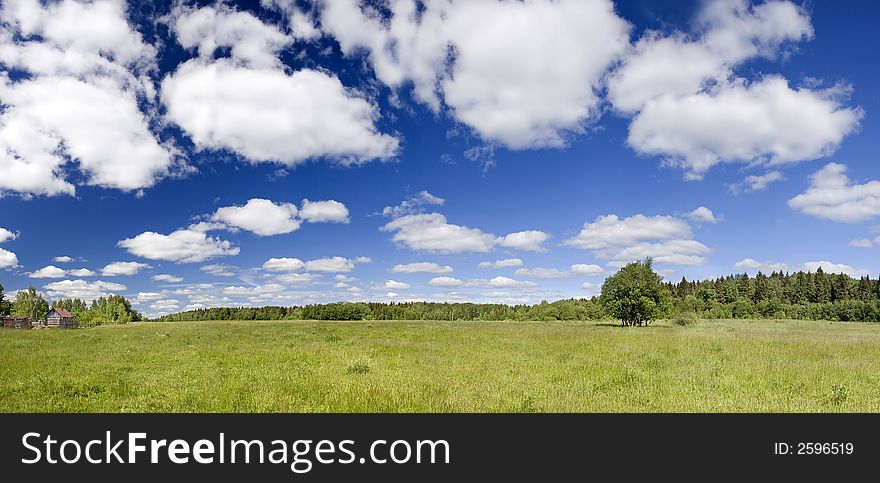 Panoramic photo of spring landscape with blue sky. Panoramic photo of spring landscape with blue sky