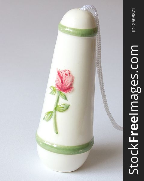 Ceramic light pull decorated with a red rose