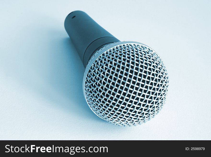 Musicians microphone against a light background