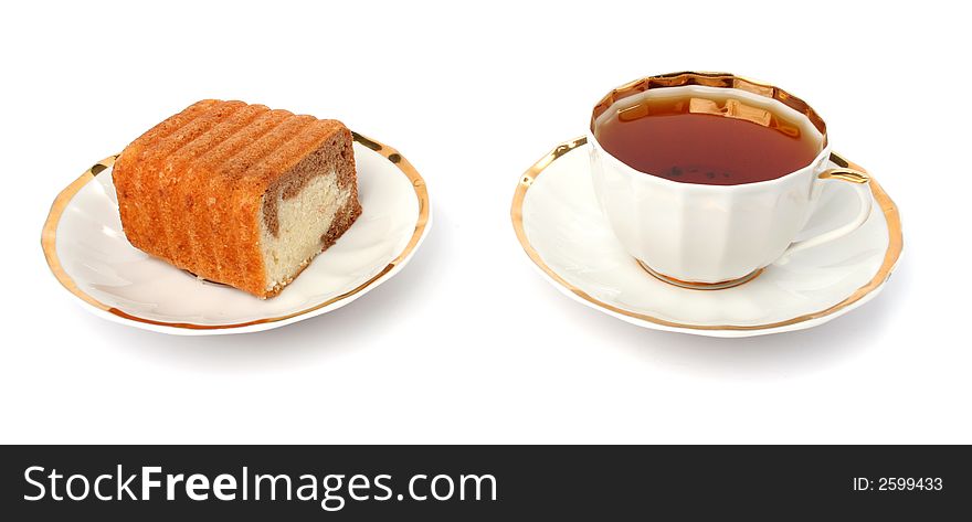 Sliced chocolate cake and cup of tea on a white background
