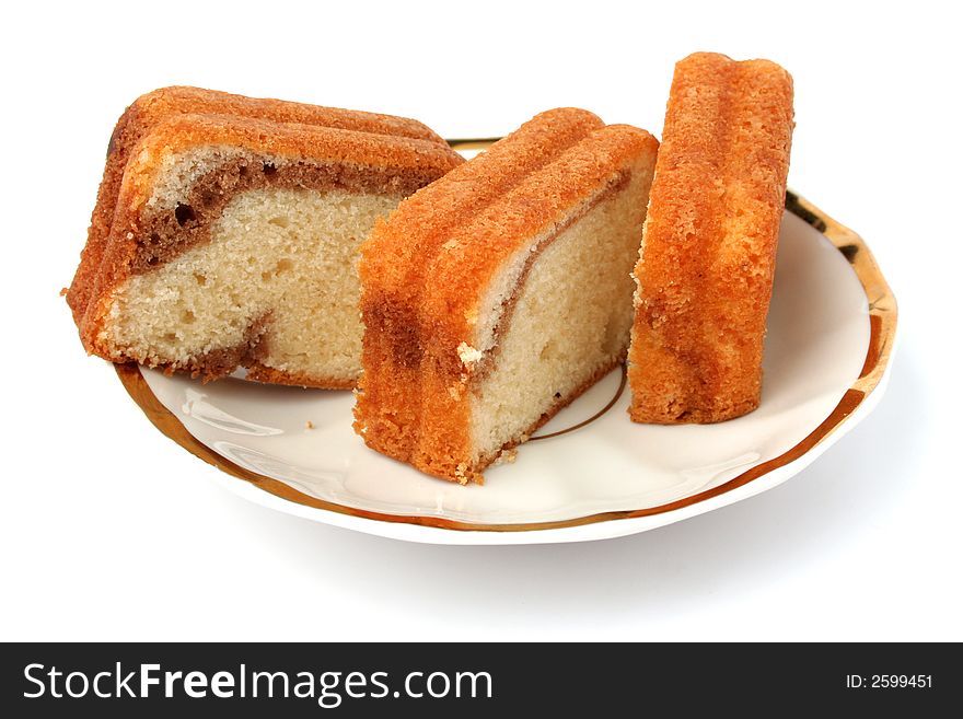 Slices of a chocolate cake on a white background