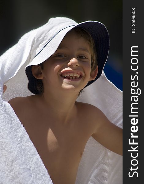 Portrait of the boy beside swimming pool