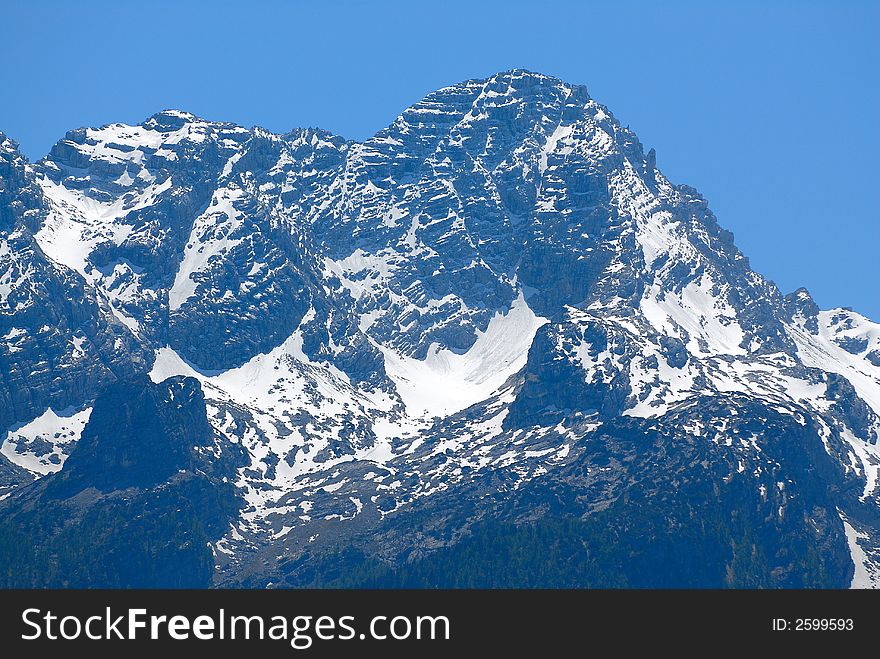 High Alps rock with snow on the top. High Alps rock with snow on the top