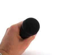 Hand With Microphone Over White Stock Photo