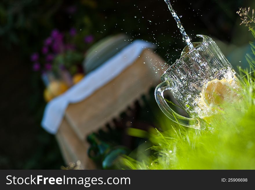 Water Pouring into Lemonade Jug