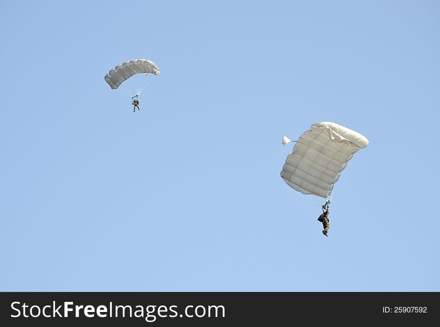 Two parachute jumpers demonstrating at an Air Show