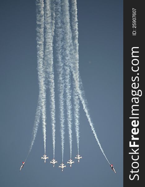 A plane formation demonstrating their acrobatics at an Air Show. A plane formation demonstrating their acrobatics at an Air Show